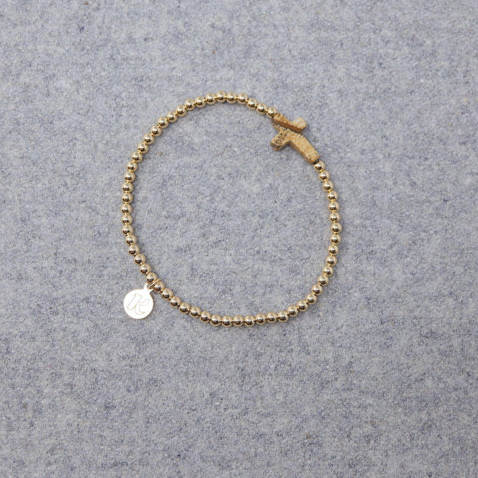 MARMOR KREUZ ARMBAND GOLDFARBIGE PERLEN